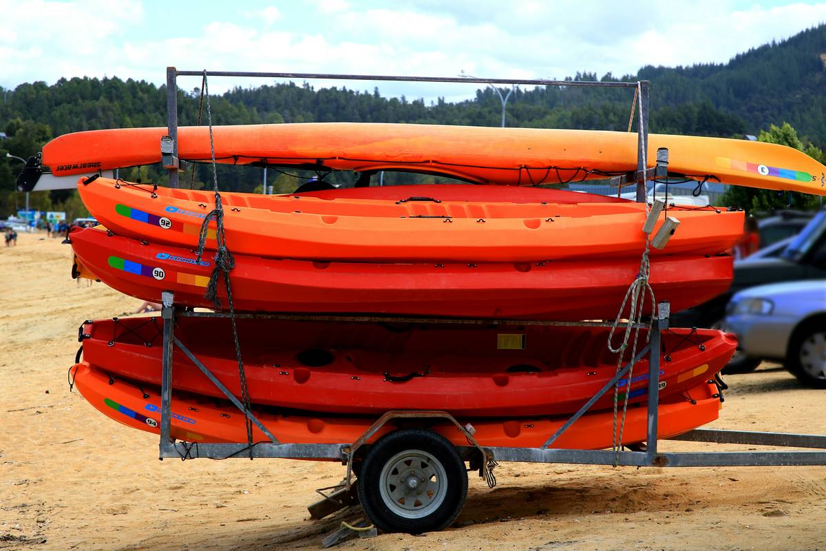 Kayak Theft Protection: Locked kayak secured with cable lock at public dock